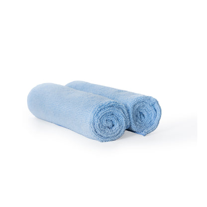 Two rolled-up Poli Glow 320 GSM blue towels on a white background